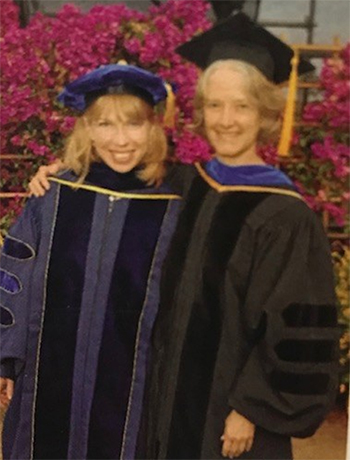 Dr. Tanya Stabler Miller and Dr. Sharon Farmer in academic regalia